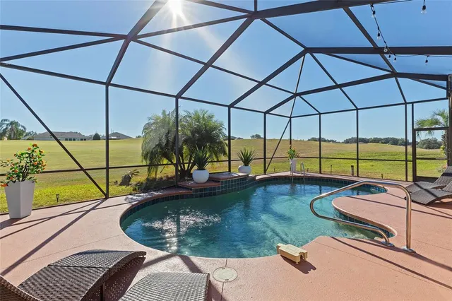 a view of a swimming pool with a lounge chairs