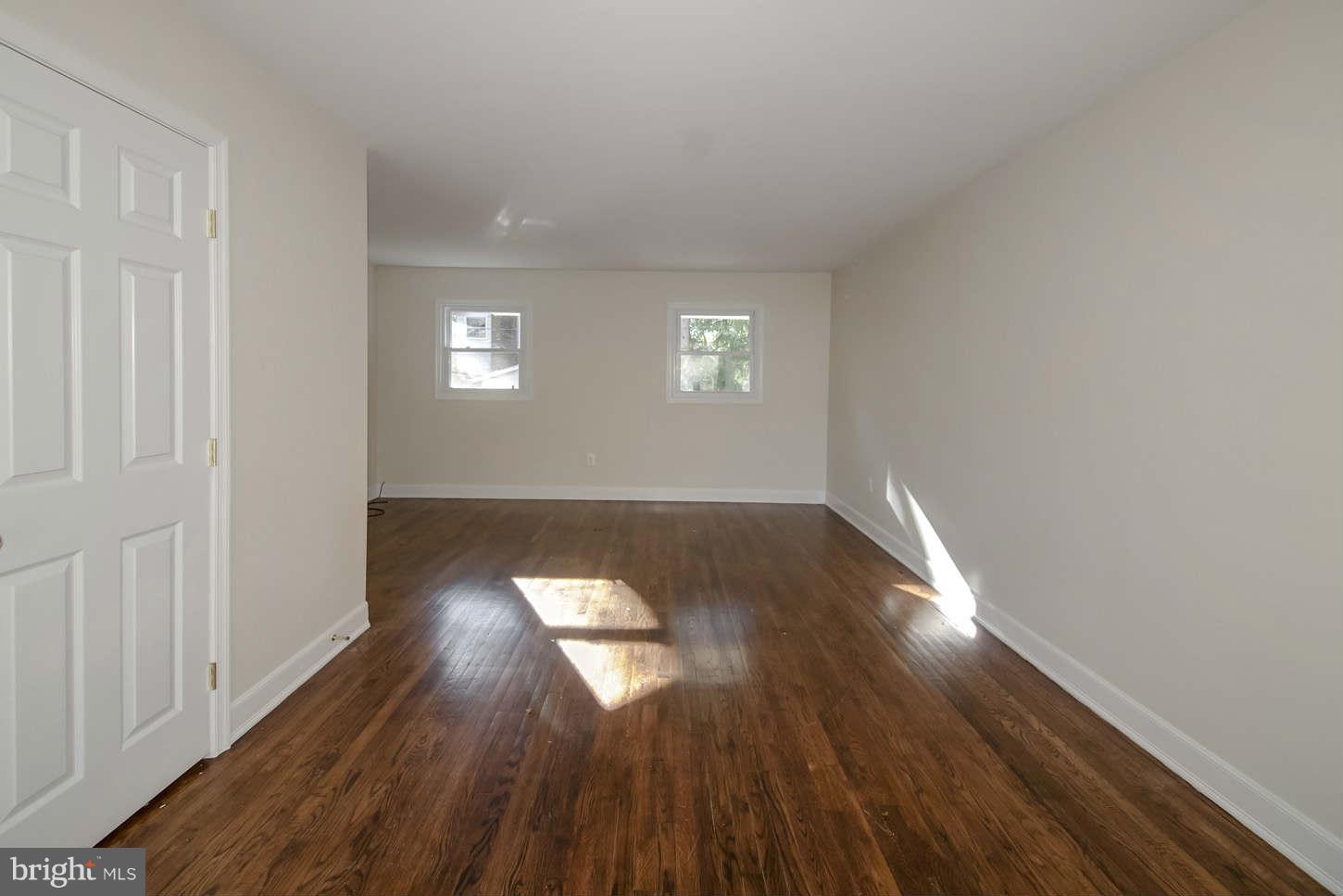 12906 Broadmore Road Silver Spring, MD 20904 - Photo 13 of 27 an empty room with wooden floor and windows