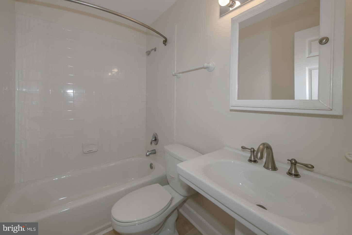 12906 Broadmore Road Silver Spring, MD 20904 - Photo 14 of 27 a bathroom with a sink toilet and shower