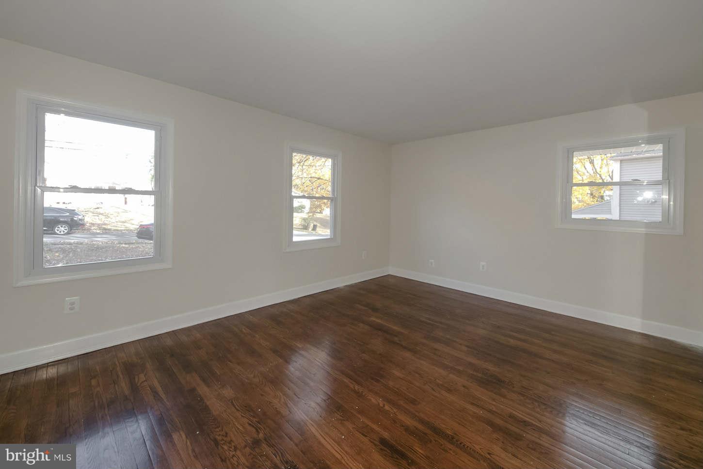 12906 Broadmore Road Silver Spring, MD 20904 - Photo 16 of 27 a view of empty room with wooden floor and fan