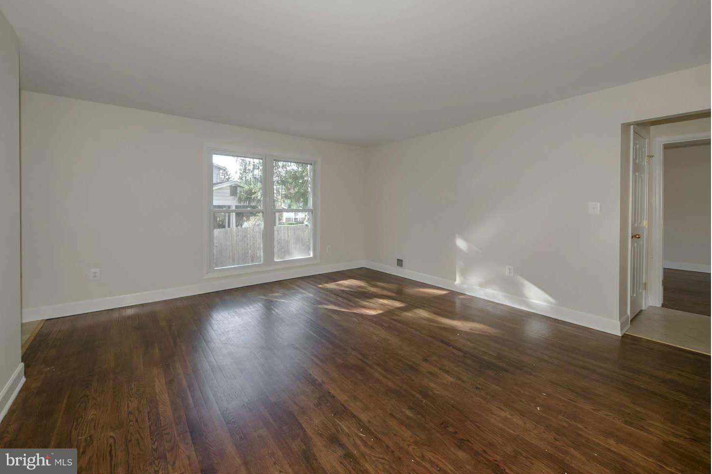 12906 Broadmore Road Silver Spring, MD 20904 - Photo 17 of 27 an empty room with wooden floor and windows