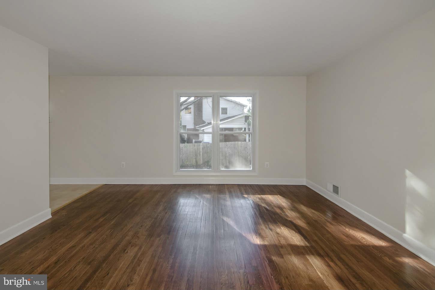 12906 Broadmore Road Silver Spring, MD 20904 - Photo 19 of 27 a view of empty room with wooden floor and fan
