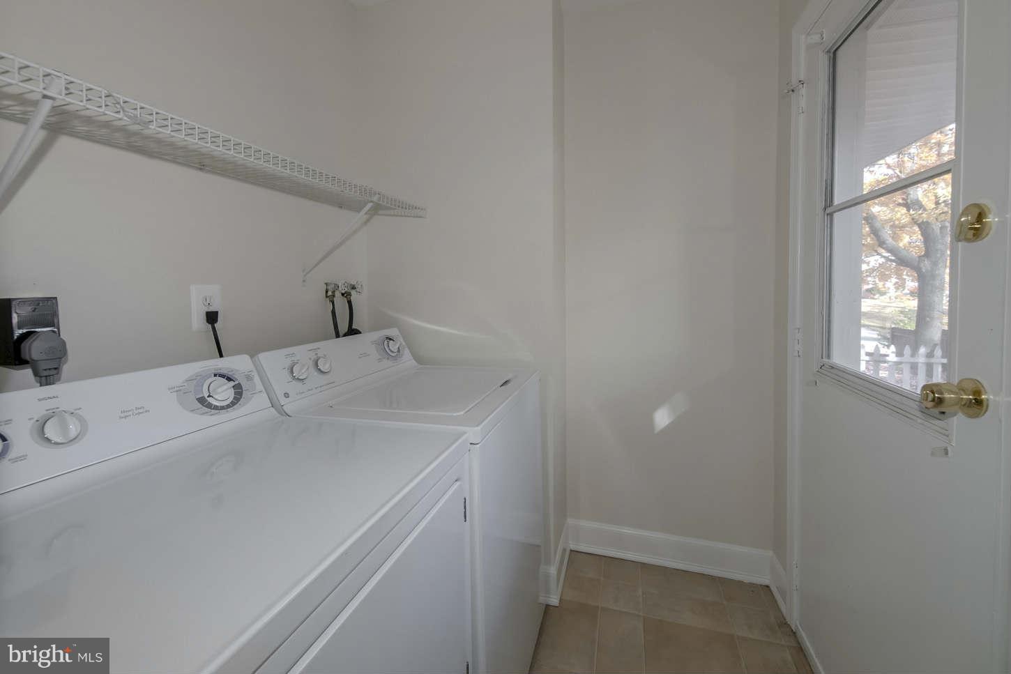 12906 Broadmore Road Silver Spring, MD 20904 - Photo 22 of 27 a utility room with dryer and washer