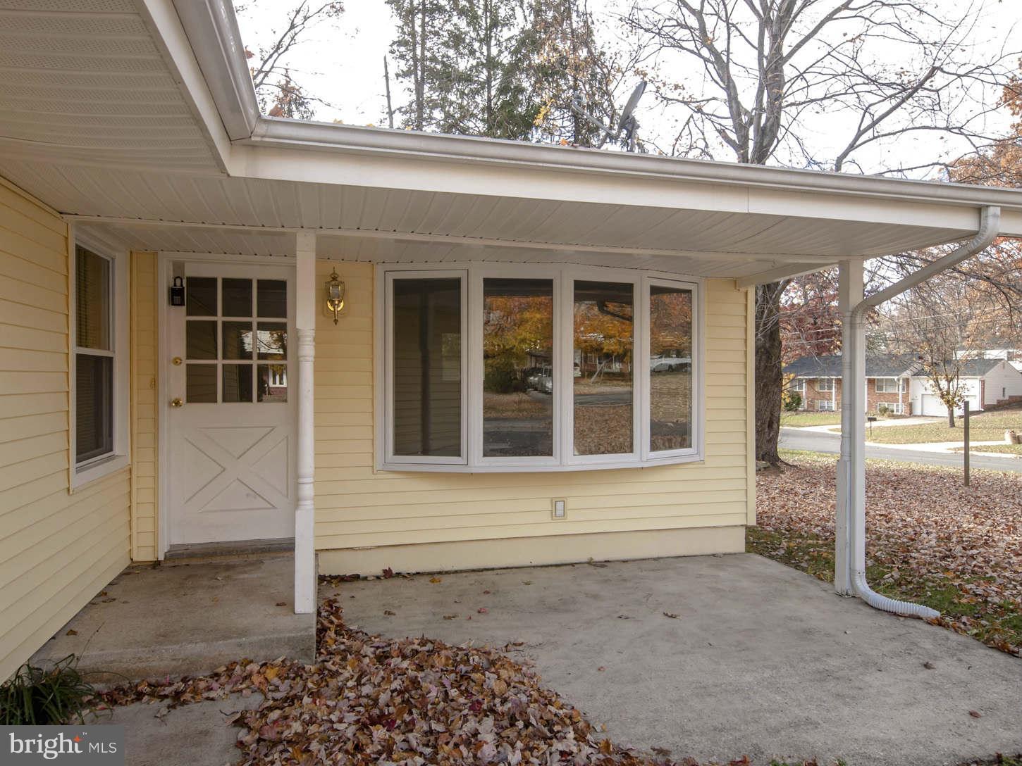 12906 Broadmore Road Silver Spring, MD 20904 - Photo 26 of 27 a front view of a house with a garden