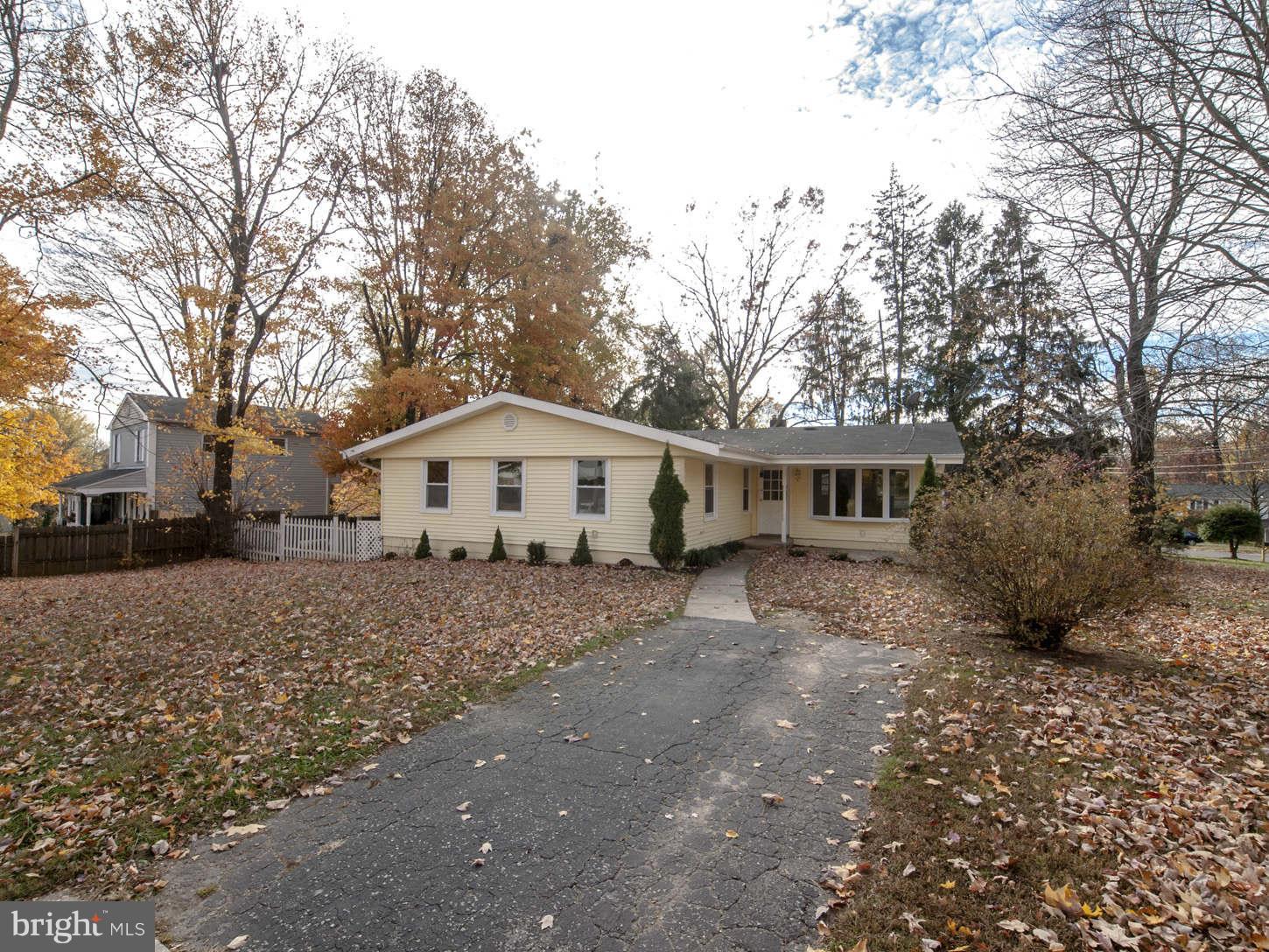12906 Broadmore Road Silver Spring, MD 20904 - Photo 5 of 27 a white house that has a tree in front of it
