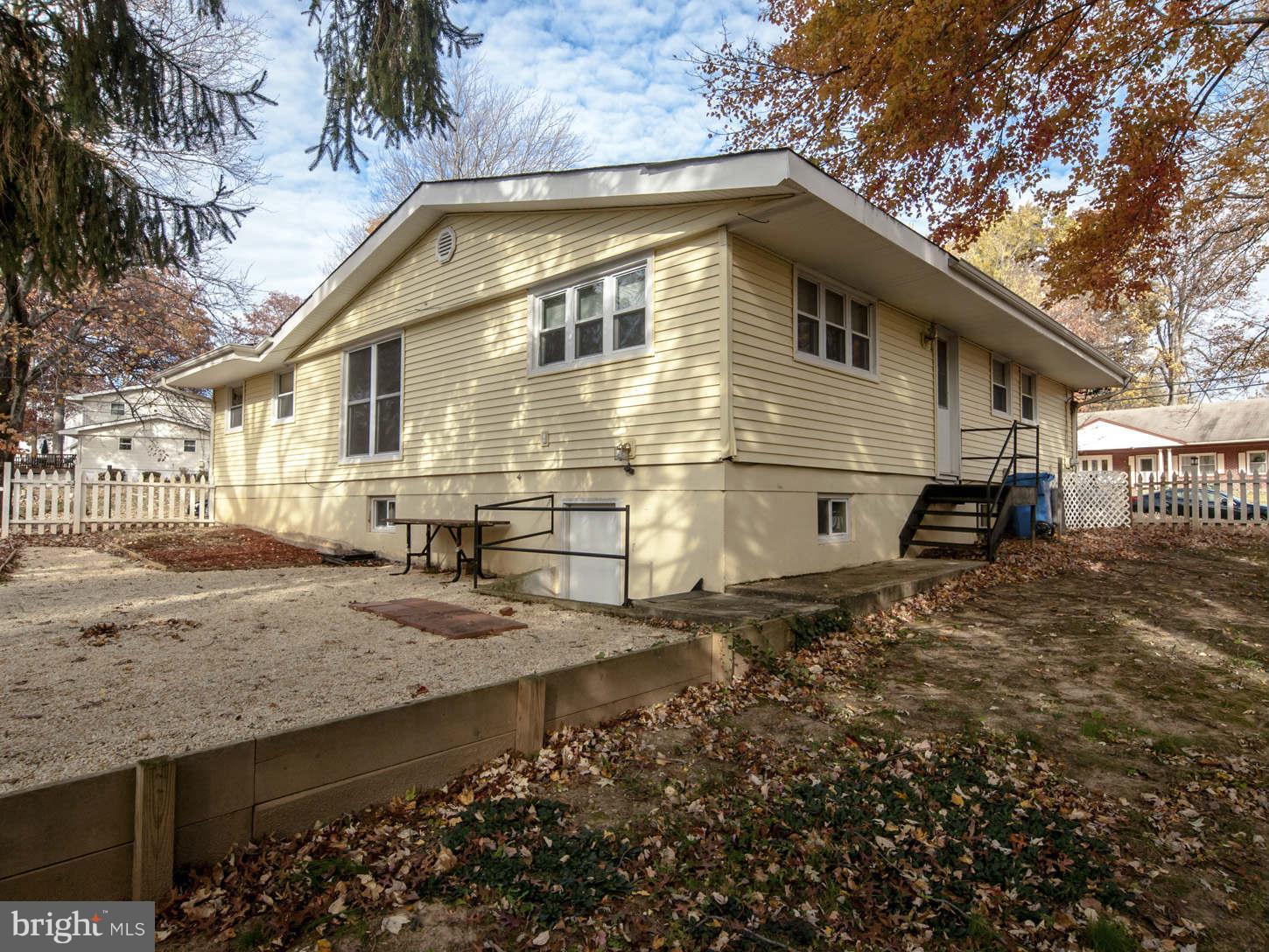 12906 Broadmore Road Silver Spring, MD 20904 - Photo 10 of 27 a front view of a house with a yard