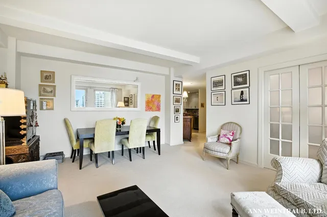 a view of a livingroom with furniture and a window