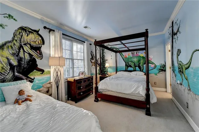 a bedroom with a bed and a lamp