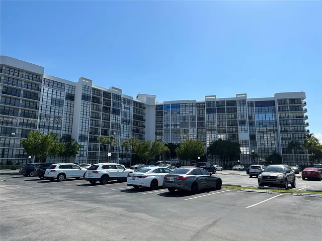 a view of cars parked in front of a building