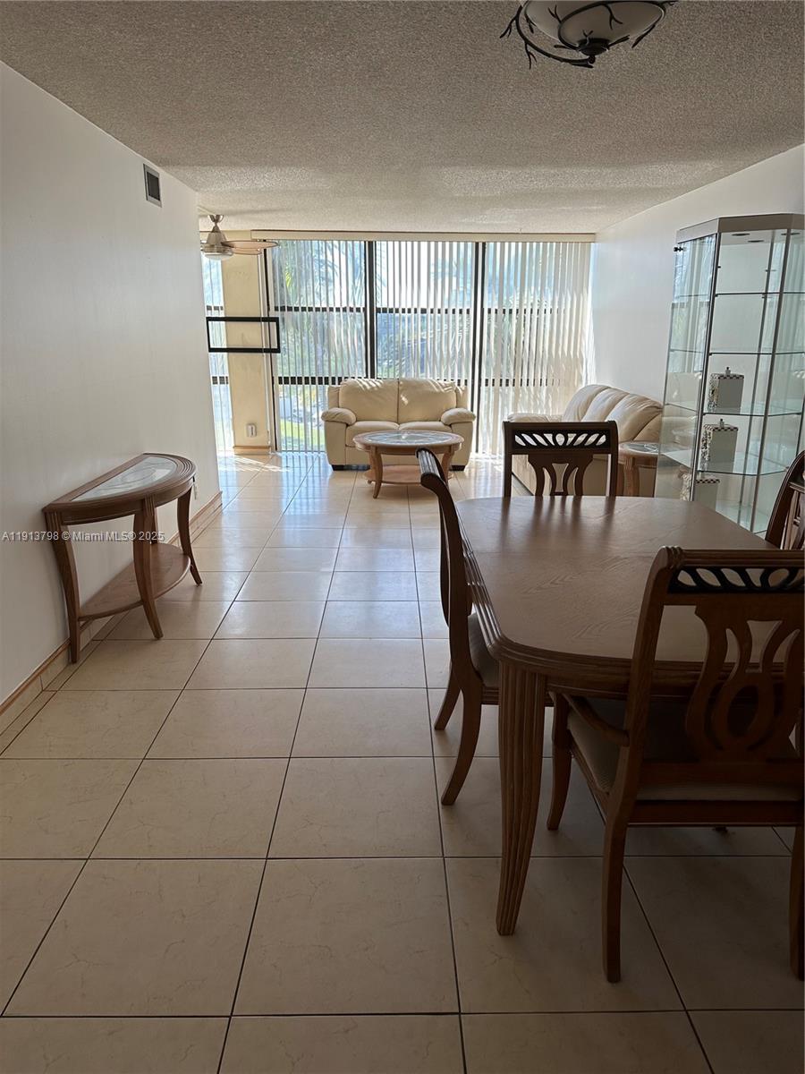 1000 Parkview Drive, Unit 325 Hallandale Beach, FL 33009 - Photo 3 of 7 a dining room with furniture and window