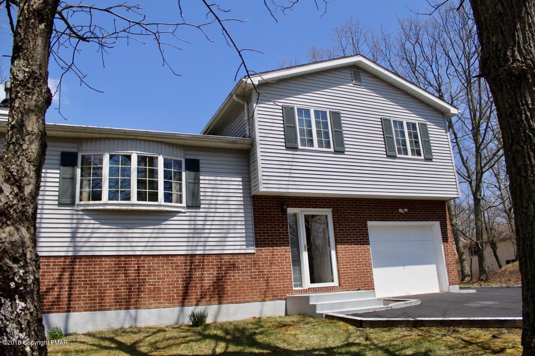 a front view of a house with garage