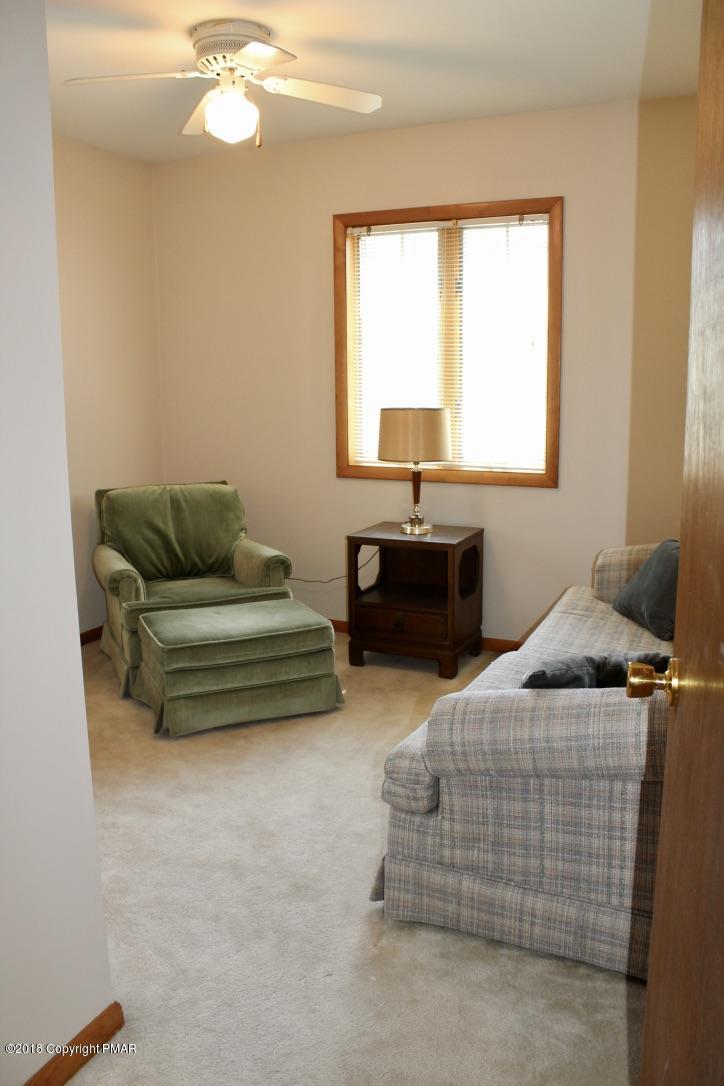 108 Gold Finch Road Bushkill, PA 18324 - Photo 18 of 32 a bedroom with furniture and window