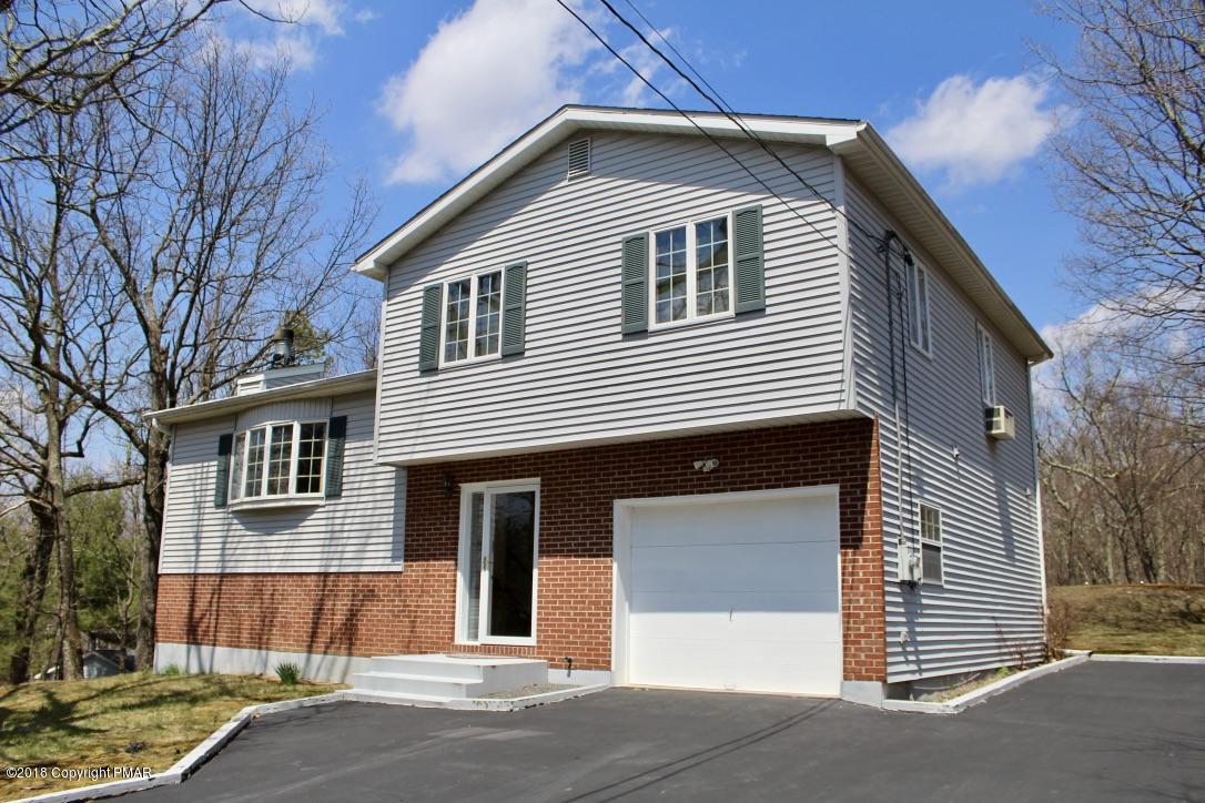 108 Gold Finch Road Bushkill, PA 18324 - Photo 2 of 32 a front view of a house with a garage