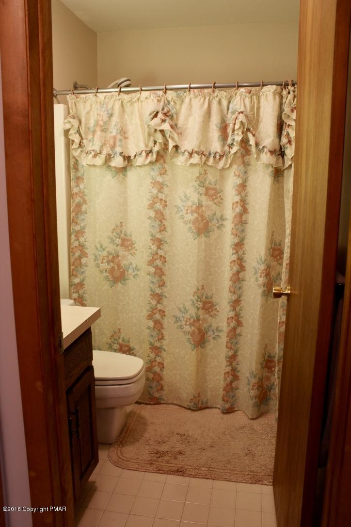 108 Gold Finch Road Bushkill, PA 18324 - Photo 23 of 32 a bathroom with a toilet and shower