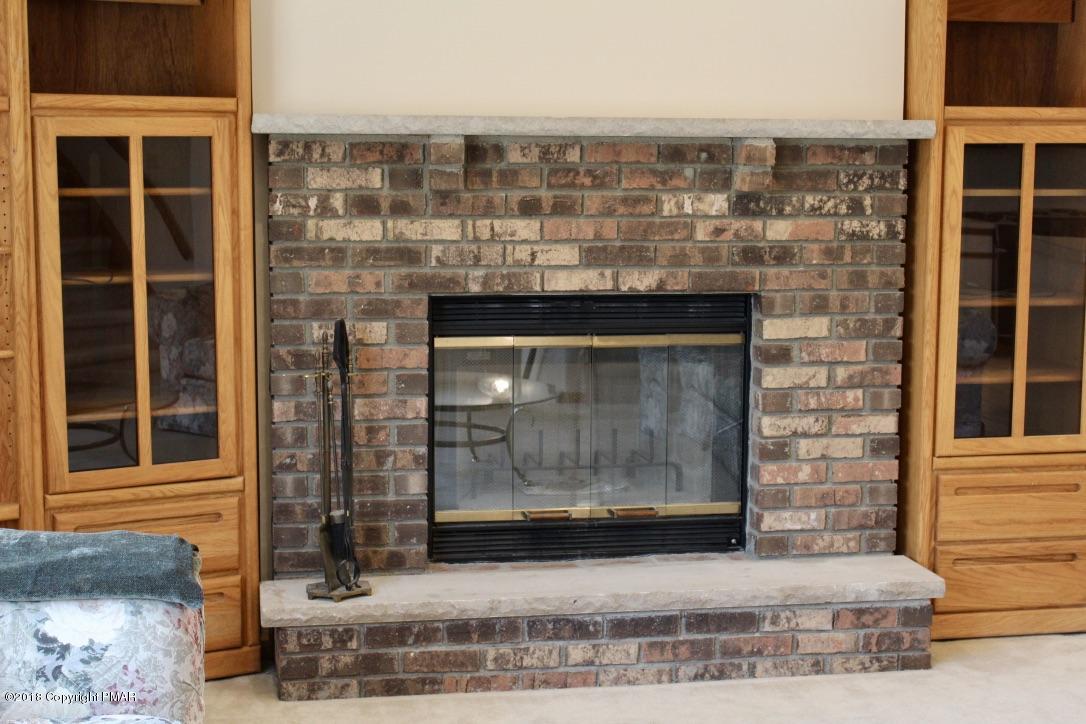 108 Gold Finch Road Bushkill, PA 18324 - Photo 9 of 32 a view of fireplace and window