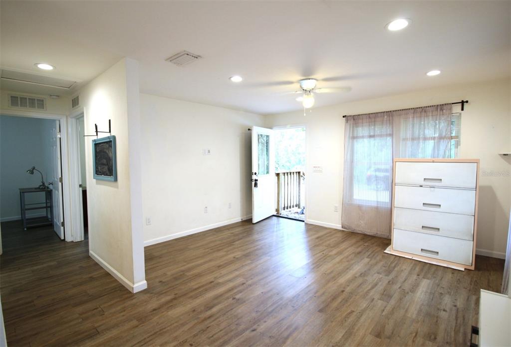 17091 Southwest 138th Lane Archer, FL 32618 - Photo 11 of 19 a view of an empty room and a kitchen