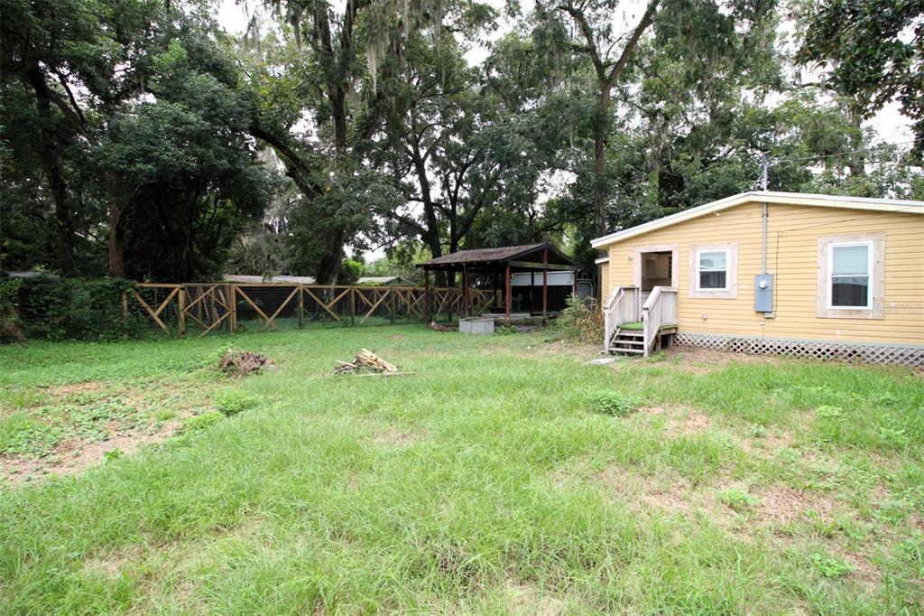 17091 Southwest 138th Lane Archer, FL 32618 - Photo 13 of 19 a view of a house with backyard and sitting area