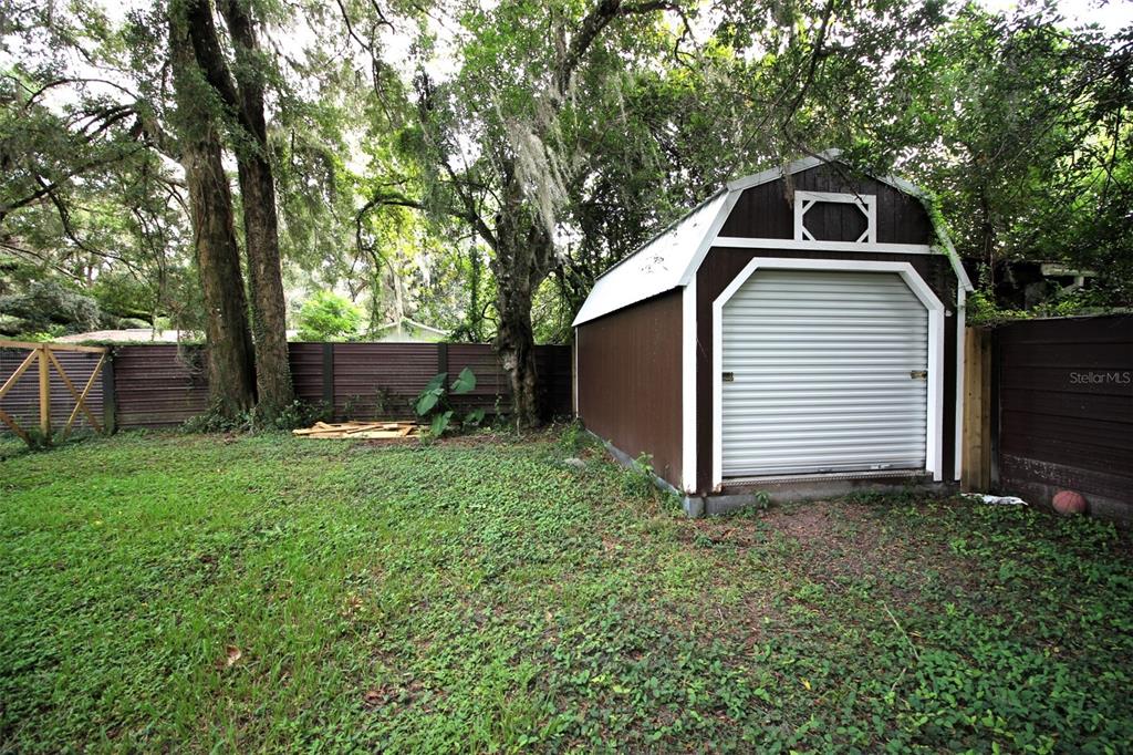 17091 Southwest 138th Lane Archer, FL 32618 - Photo 15 of 19 a front view of a house with garden