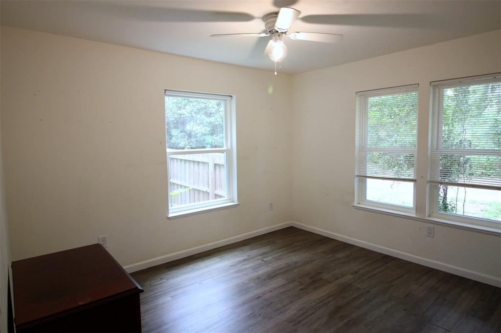 17091 Southwest 138th Lane Archer, FL 32618 - Photo 7 of 19 a view of an empty room with wooden floor and a window