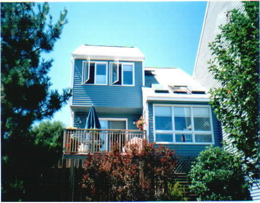 23 Hatherly Road, Unit 2 Scituate, MA 02066 - Photo 1 of 1 a front view of a house with a garden