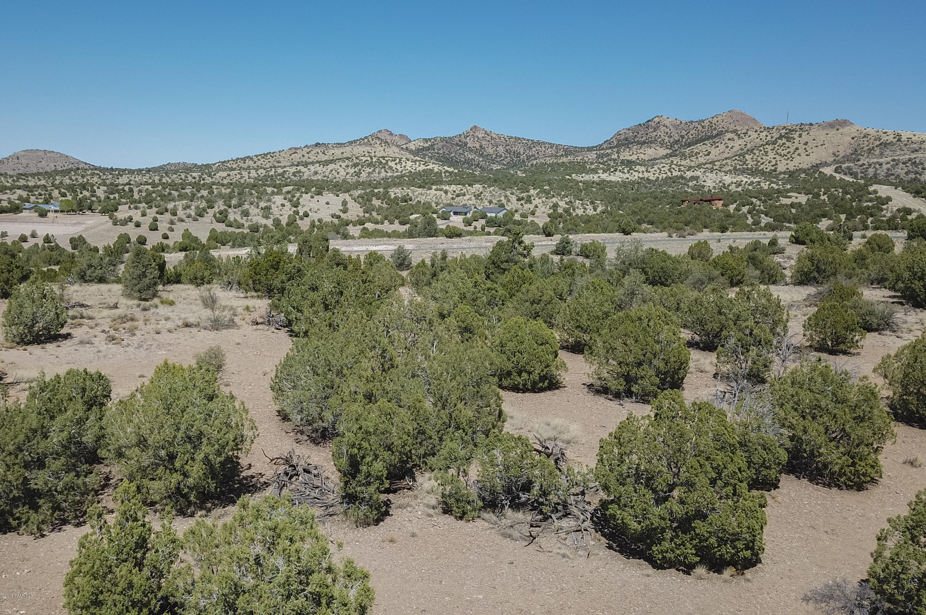 18500 Crossroads Ranch Road Prescott, AZ 86305 - Photo 10 of 21 an aerial view of a houses with a street and mountains