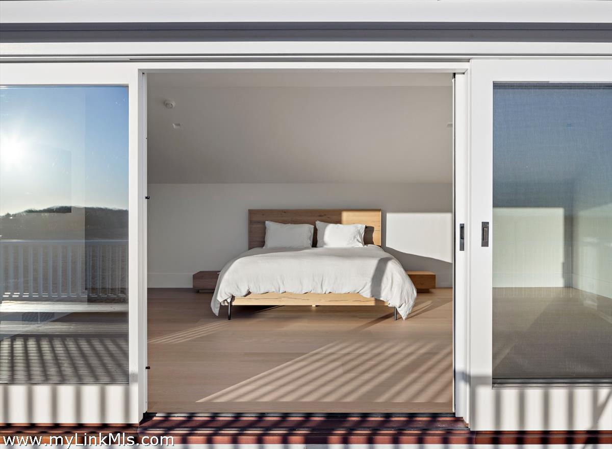 146 Quenames Road Chilmark, MA 02535 - Photo 25 of 77 The Farmhouse deck off the Primary Bedroom