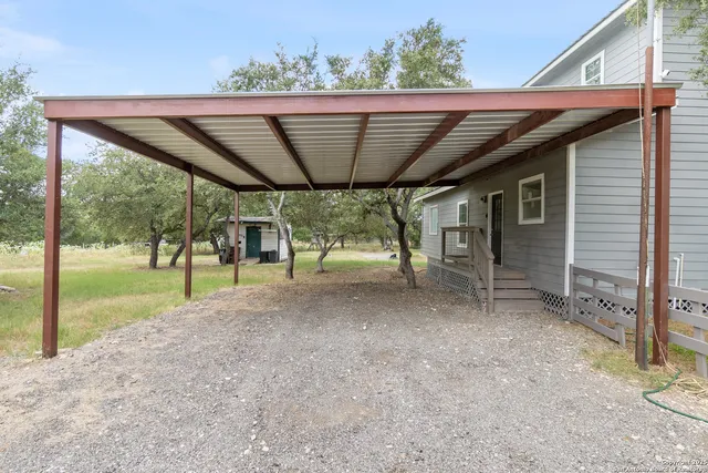 an aerial view of houses with yard