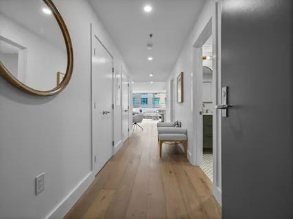 wooden floor with a bathroom