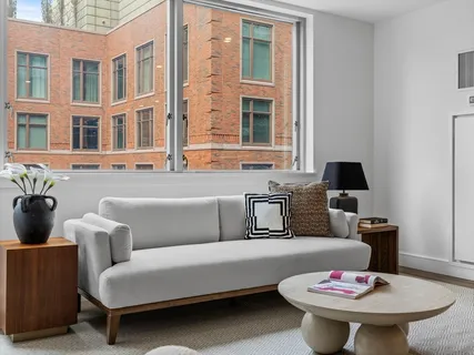 a living room with furniture and a window