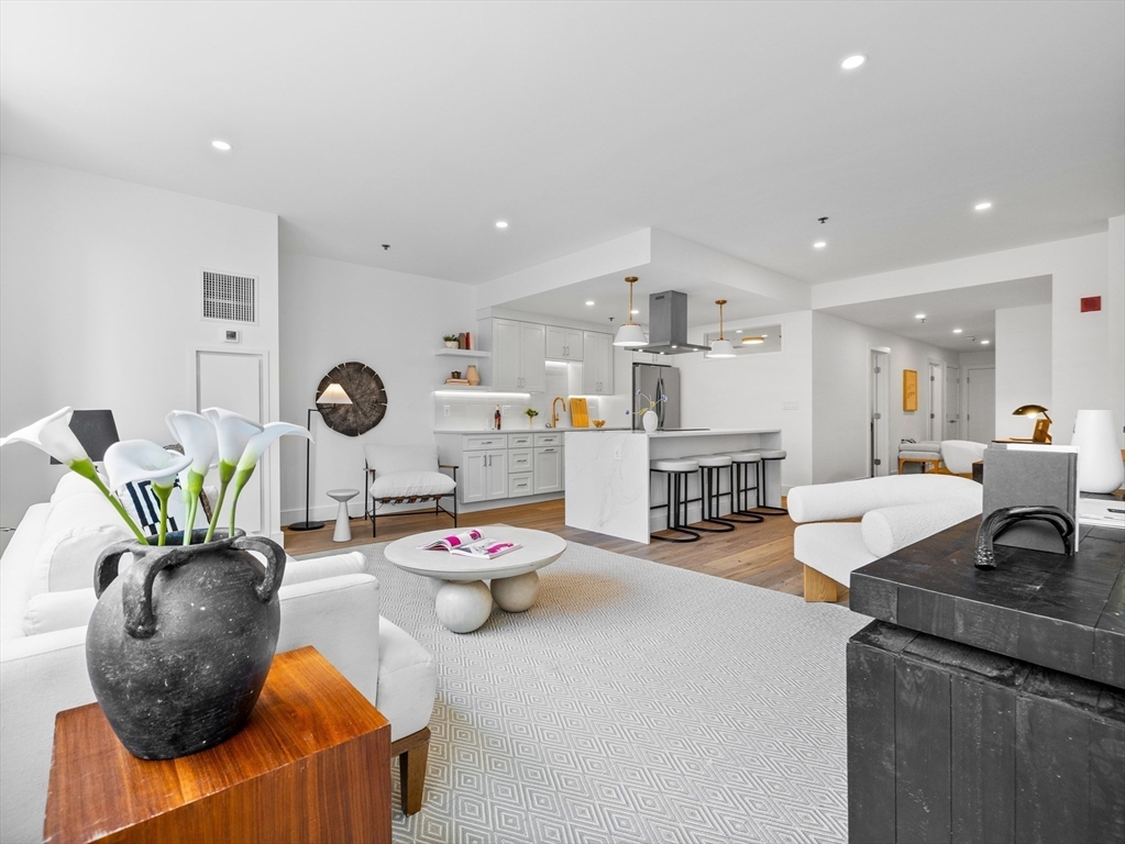 234 Causeway Street, Unit U702 Boston, MA 02114 - Photo 7 of 27 a living room with furniture and a wooden floor
