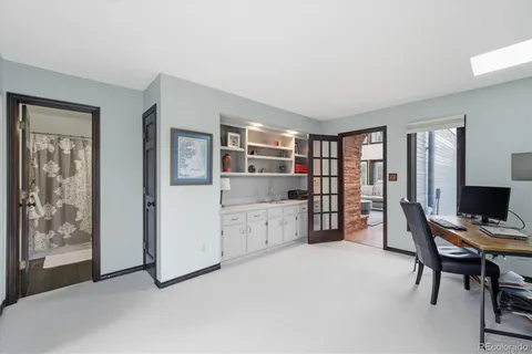 a spacious bedroom with a large bed and a large window