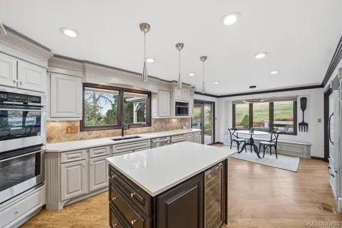 a kitchen with a sink and refrigerator