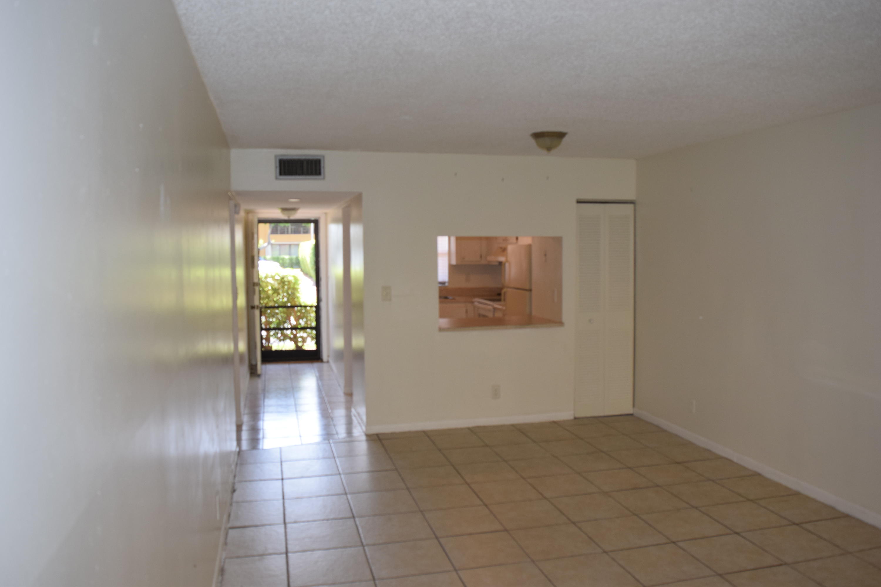 2041 Woolbright Road, Unit H104 Boynton Beach, FL 33426 - Photo 5 of 10 Living Room (2)