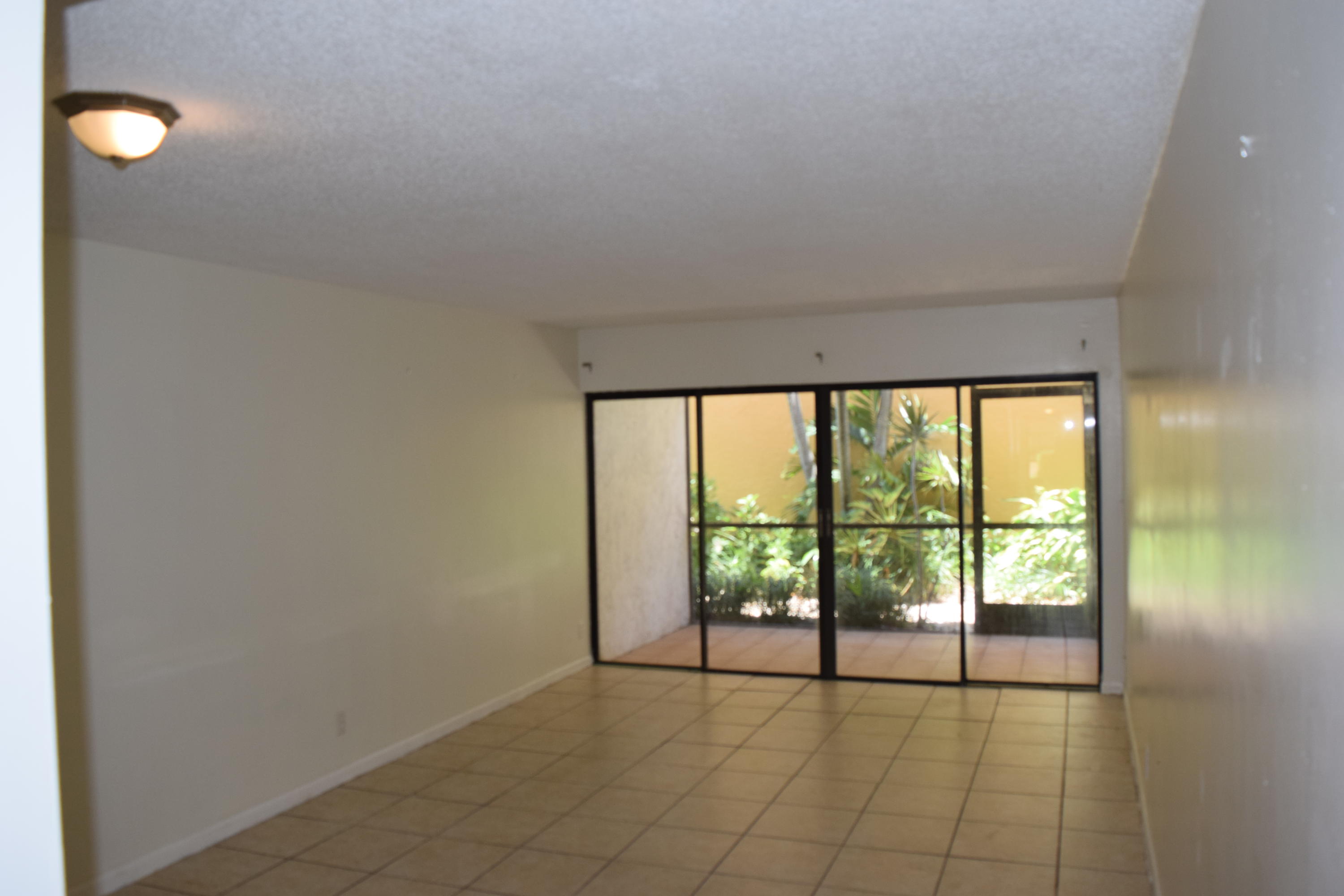2041 Woolbright Road, Unit H104 Boynton Beach, FL 33426 - Photo 7 of 10 Living ROom