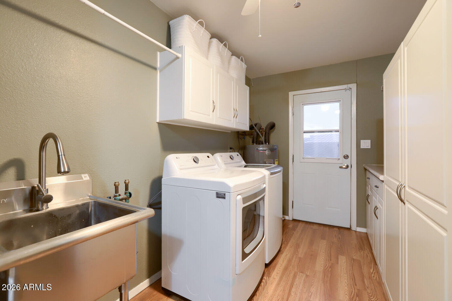 3641 West Grandview Road Phoenix, AZ 85053 - Photo 15 of 22 Laundry with storage and pantry