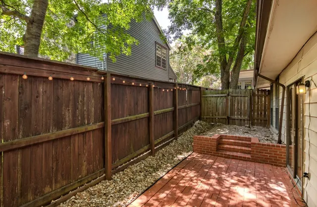 a view of small space with wooden fence