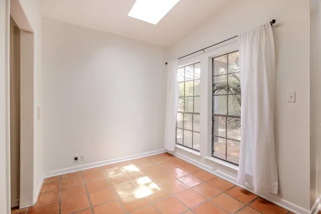 a view of an empty room and window