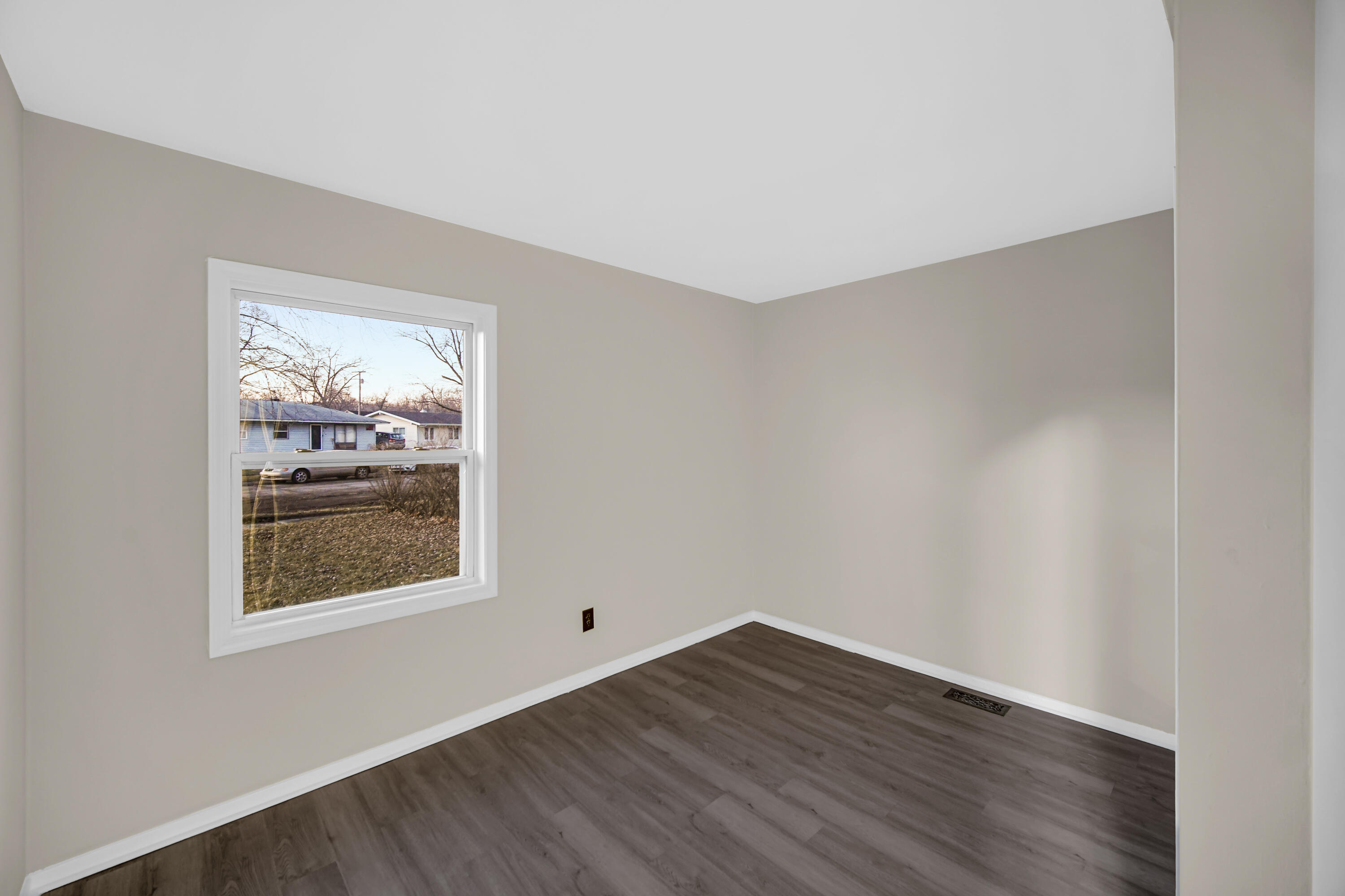 625 South Wells Street Gary, IN 46403 - Photo 15 of 18 an empty room with wooden floor and windows