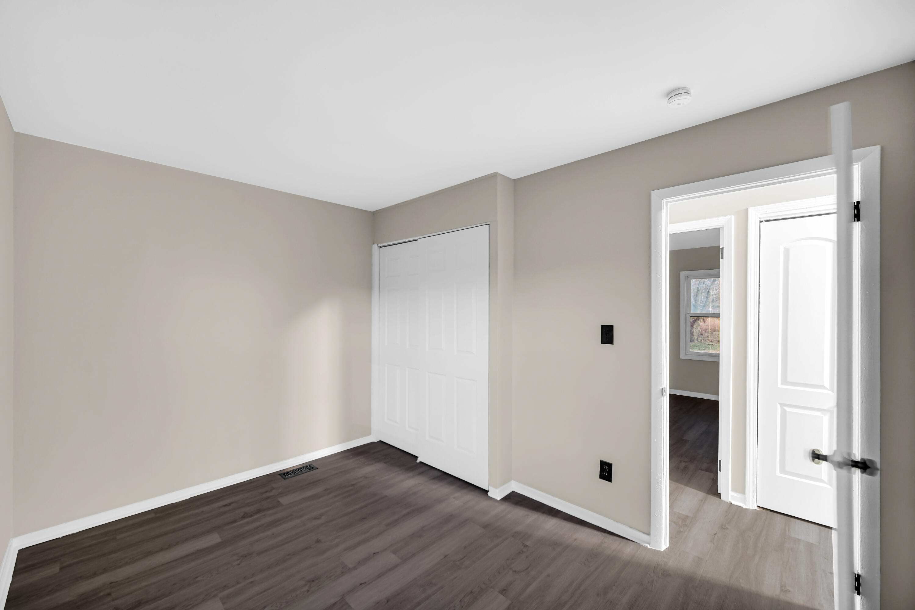 625 South Wells Street Gary, IN 46403 - Photo 16 of 18 a view of a room with wooden floor and a window