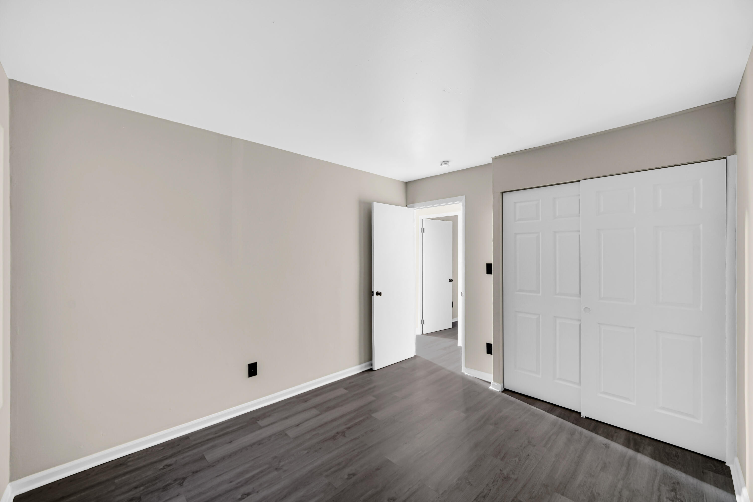 625 South Wells Street Gary, IN 46403 - Photo 18 of 18 a view of an empty room with wooden floor