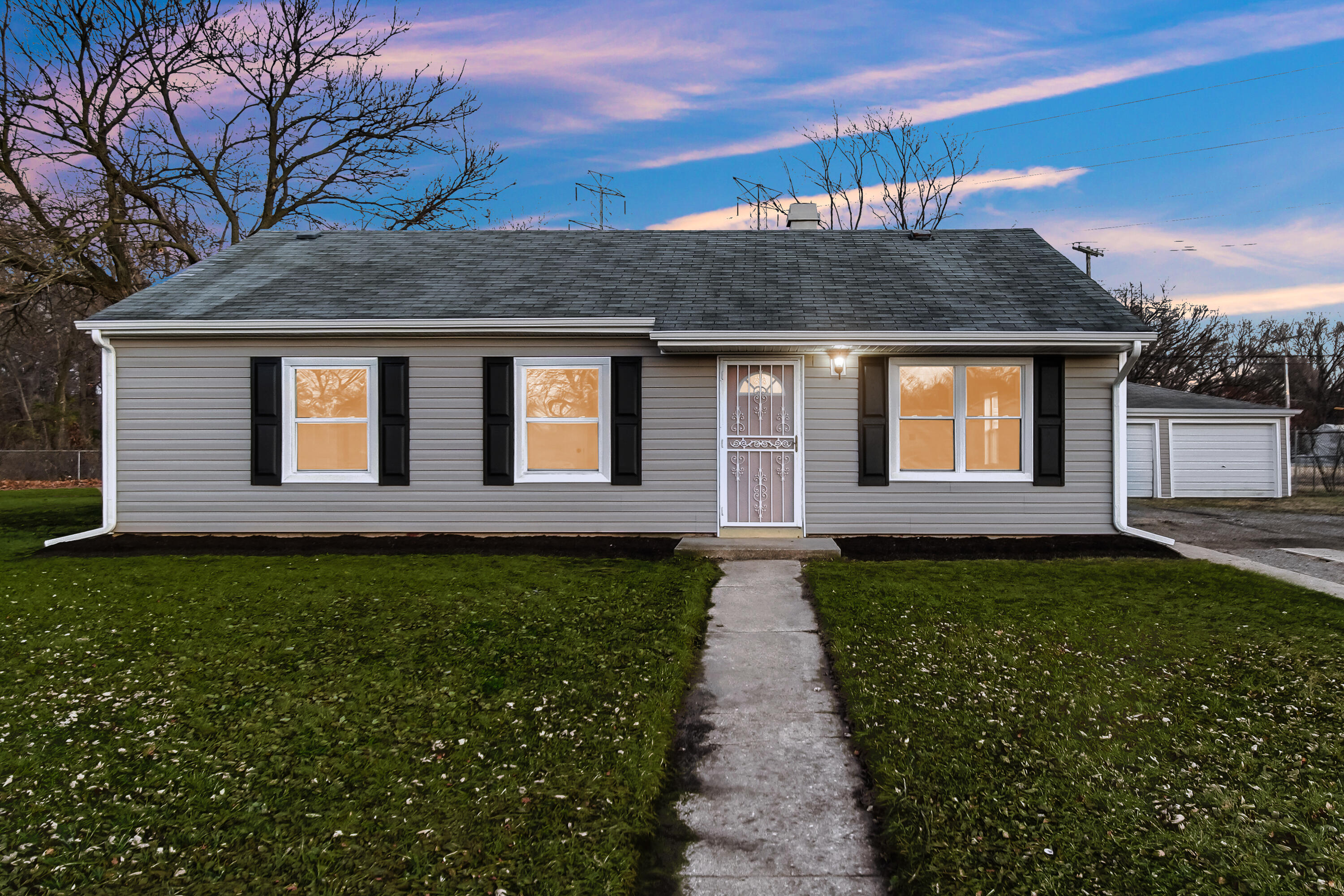 625 South Wells Street Gary, IN 46403 - Photo 2 of 18 a front view of a house with a yard