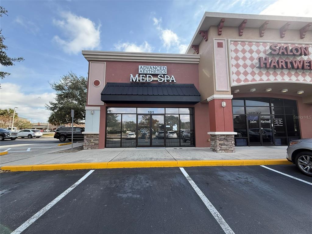1925 Southwest 18th Court, Unit 101 Ocala, FL 34471 - Photo 1 of 1 a view of a swimming pool with sitting area in front of house