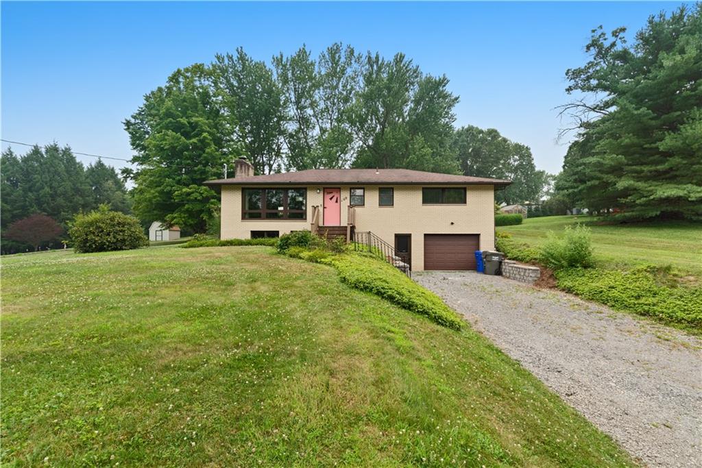 109 Beacon Road Renfrew, PA 16053 - Photo 2 of 33 a view of a house with backyard and garden