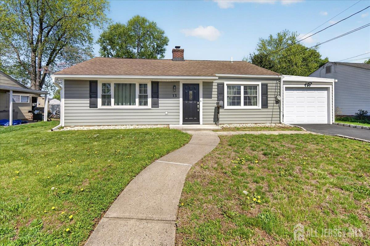 13 Comstock Road Edison, NJ 08817 - Photo 1 of 22 front view of a house with a yard