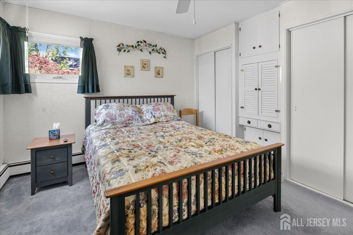 13 Comstock Road Edison, NJ 08817 - Photo 11 of 22 a bed sitting in a bedroom next to a window