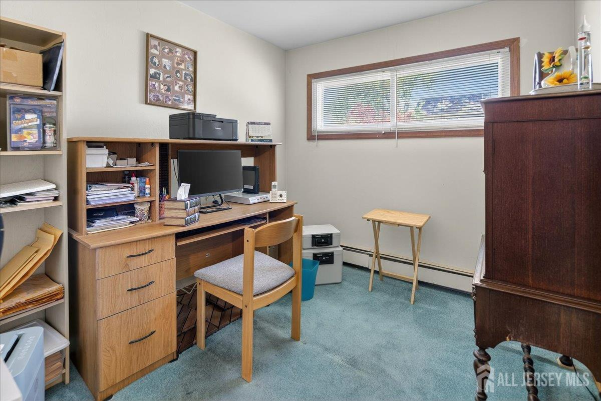 13 Comstock Road Edison, NJ 08817 - Photo 15 of 22 a workspace with furniture and lamp