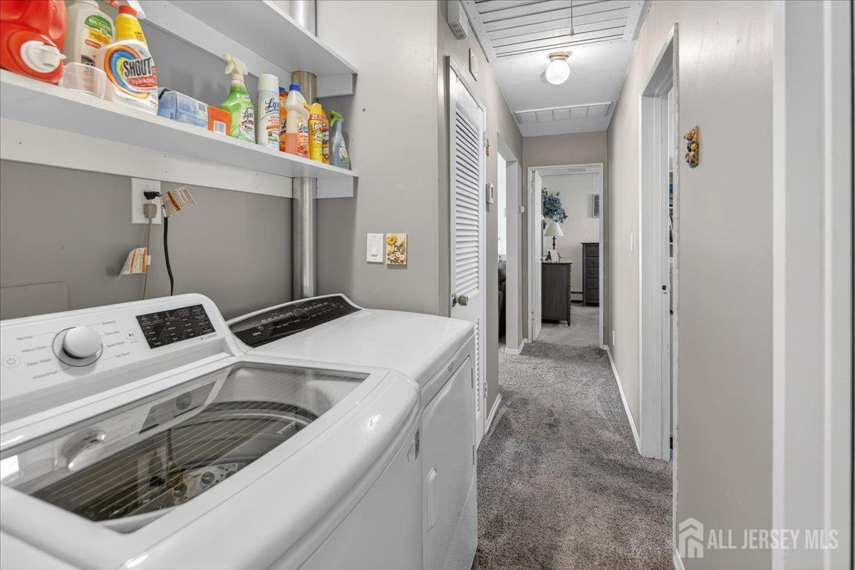 13 Comstock Road Edison, NJ 08817 - Photo 16 of 22 a utility room with dryer and washer