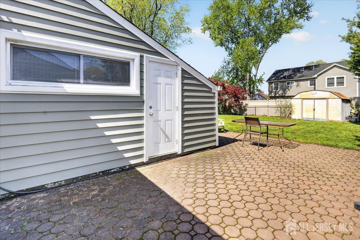 13 Comstock Road Edison, NJ 08817 - Photo 20 of 22 a side view of a house with a yard