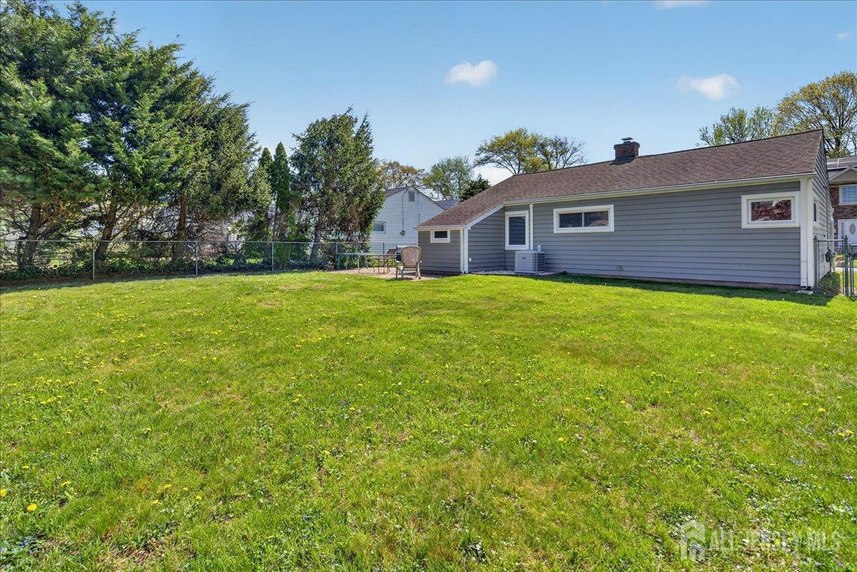 13 Comstock Road Edison, NJ 08817 - Photo 21 of 22 a front view of a house with yard