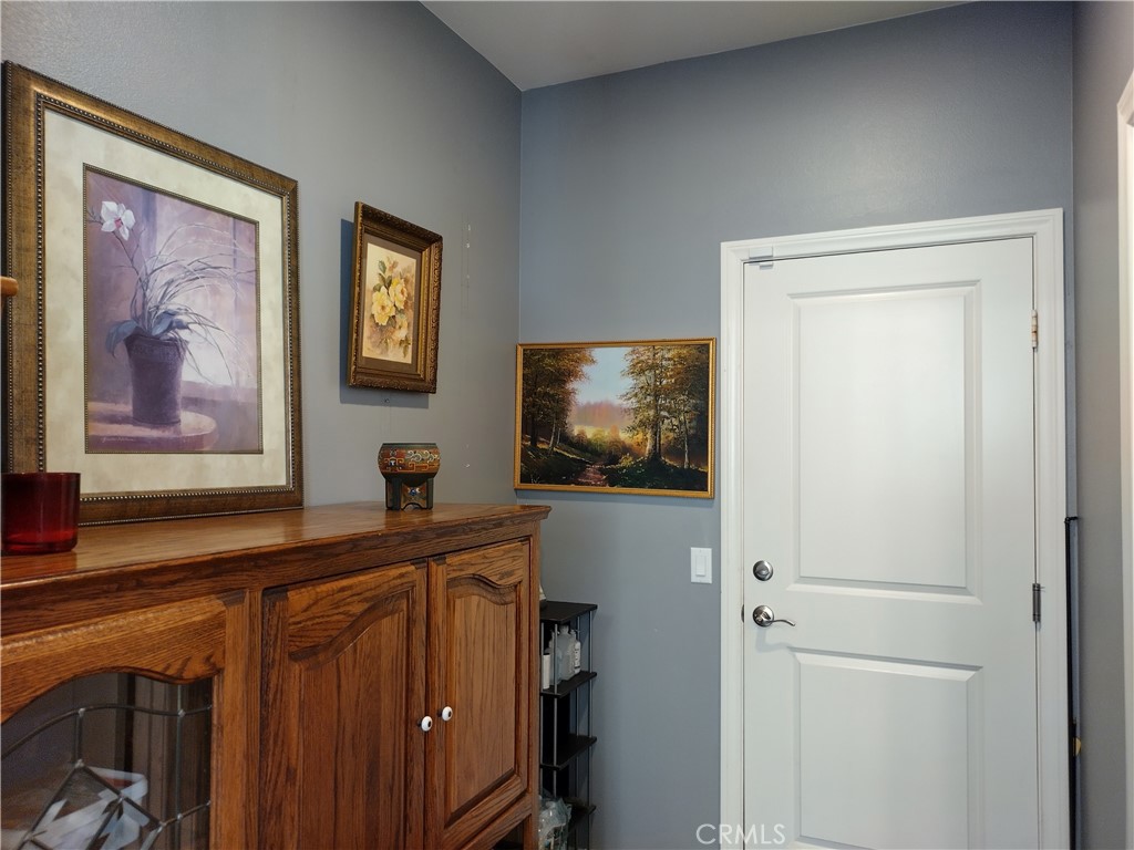 11811 Cramer Road Yucaipa, CA 92399 - Photo 20 of 56 a view of a livingroom with furniture and a flat screen tv